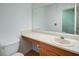 Clean bathroom with a laminate countertop, white walls, and new toilet at 1315 Bustling Sw Ln, Marietta, GA 30064