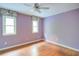 Empty bedroom with wood flooring and natural light coming through the windows at 1315 Bustling Sw Ln, Marietta, GA 30064