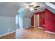 Bedroom with vaulted ceilings, fan, hardwood floors, and unique architecture at 1315 Bustling Sw Ln, Marietta, GA 30064