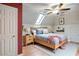 Light-filled bedroom with light hardwood floors, fan, skylight, and neutral walls at 1315 Bustling Sw Ln, Marietta, GA 30064