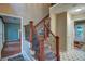 Inviting foyer features hardwood floors, a staircase with decorative wrought iron, and lots of natural light at 1315 Bustling Sw Ln, Marietta, GA 30064