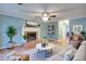 Stylish living room with a cozy fireplace, modern decor, and a comfortable seating area at 1315 Bustling Sw Ln, Marietta, GA 30064