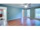Spacious living room with hardwood floors and large windows offering plenty of natural light at 1315 Bustling Sw Ln, Marietta, GA 30064
