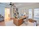 Bright home office with built-in shelves, stylish desk, and French doors to a patio at 1315 Bustling Sw Ln, Marietta, GA 30064