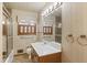 Bathroom featuring wallpaper, large vanity, and shower with glass door at 1470 Biltmore Ne Dr, Atlanta, GA 30329