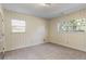 Bright bedroom features natural light through windows, neutral carpet, and ceiling fan at 1470 Biltmore Ne Dr, Atlanta, GA 30329
