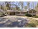 Charming one-story home with a carport and an expansive front yard with mature trees at 1470 Biltmore Ne Dr, Atlanta, GA 30329