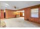View of living room featuring paneled walls and fireplace at 1470 Biltmore Ne Dr, Atlanta, GA 30329
