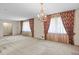 Spacious living room with carpet flooring, large windows, and elegant curtains at 1470 Biltmore Ne Dr, Atlanta, GA 30329