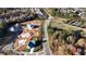 Aerial view of a neighborhood with new constructions, showcasing street layout and surrounding landscape at 2875 Caney Parc Way, Cumming, GA 30041