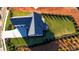 Overhead shot of a modern home with manicured lawn and landscaping, showcasing its roof and driveway at 2875 Caney Parc Way, Cumming, GA 30041