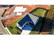 Aerial view of a newly constructed home with a manicured lawn and an expansive driveway at 2875 Caney Parc Way, Cumming, GA 30041