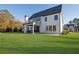 Beautiful two-story home with a large yard and an outdoor patio at 2875 Caney Parc Way, Cumming, GA 30041