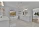 Bright bathroom features dual vanities, floating shelves, and a standalone soaking tub with a window at 2875 Caney Parc Way, Cumming, GA 30041