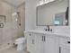 Modern bathroom featuring a glass shower and a white vanity at 2875 Caney Parc Way, Cumming, GA 30041