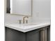 Close-up of bathroom vanity featuring modern fixtures and quartz countertop at 2875 Caney Parc Way, Cumming, GA 30041