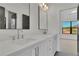 Bright bathroom with double sinks, and a large window providing natural light at 2875 Caney Parc Way, Cumming, GA 30041