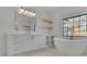 Well-lit bathroom features a modern vanity, soaking tub, and floating shelves for storage and display at 2875 Caney Parc Way, Cumming, GA 30041