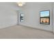 Bedroom with neutral carpeting, trim, and dual windows at 2875 Caney Parc Way, Cumming, GA 30041