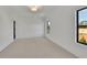 Bright bedroom with neutral carpet, black trim windows and white walls at 2875 Caney Parc Way, Cumming, GA 30041