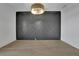 Elegant dining room with hardwood floors and custom paneling with modern lighting at 2875 Caney Parc Way, Cumming, GA 30041