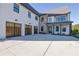 Beautiful home exterior with a stone facade accent, three-car garage, and a concrete driveway at 2875 Caney Parc Way, Cumming, GA 30041