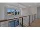 Second-story hallway with views and railing detail at 2875 Caney Parc Way, Cumming, GA 30041