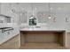 Bright kitchen with stainless steel appliances, a center island, quartz countertops and custom cabinets at 2875 Caney Parc Way, Cumming, GA 30041