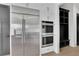 Contemporary kitchen with stainless steel appliances, double ovens, and custom cabinets at 2875 Caney Parc Way, Cumming, GA 30041