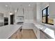 Bright, open kitchen with stainless steel appliances, island and white countertops at 2875 Caney Parc Way, Cumming, GA 30041