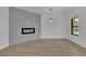 Bright and inviting living room with wood floors and an electric fireplace feature wall at 2875 Caney Parc Way, Cumming, GA 30041