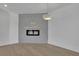 Stylish living room with wood floors, ambient lighting, and an electric fireplace at 2875 Caney Parc Way, Cumming, GA 30041