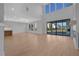 Bright living room with hardwood floors, a modern fireplace, and large sliding doors to patio at 2875 Caney Parc Way, Cumming, GA 30041