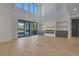 Bright living room with expansive windows and modern fireplace at 2875 Caney Parc Way, Cumming, GA 30041