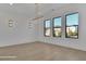 Bright living room featuring hardwood floors, recessed lighting, and large windows for ample natural light at 2875 Caney Parc Way, Cumming, GA 30041