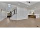 Open-concept living space with hardwood floors, high ceilings, and a staircase to the second floor at 2875 Caney Parc Way, Cumming, GA 30041