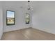 Bright, spacious room with hardwood floors and natural light streaming through the windows at 2875 Caney Parc Way, Cumming, GA 30041