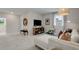Open loft featuring a comfortable seating area, entertainment center, and large windows with scenic views at 5270 Trescott Path, Cumming, GA 30028