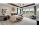 Beautifully decorated main bedroom featuring tray ceilings, plush carpet, and view of nature at 5270 Trescott Path, Cumming, GA 30028