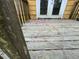 Exterior of a wooden backyard deck needing repairs with some rot at 6127 Pinegrove Rd, Riverdale, GA 30274