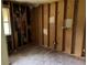 Room showcasing exposed framework and studs, ready for renovation and customization at 6127 Pinegrove Rd, Riverdale, GA 30274