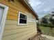 Exterior showing siding of the house, a window, and the lawn at 6127 Pinegrove Rd, Riverdale, GA 30274