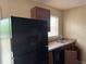 Another view of the functional kitchen space with appliances and ample countertop space at 6127 Pinegrove Rd, Riverdale, GA 30274