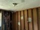 This room's unfinished ceiling and framing offers a customizable space for the next owner at 6127 Pinegrove Rd, Riverdale, GA 30274