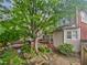 Outdoor living area with deck, outdoor kitchen, rock garden, and lush landscaping at 2123 Tigger Ne Trce, Marietta, GA 30066
