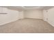 An open basement space with neutral carpeting and recessed ceiling lighting at 2123 Tigger Ne Trce, Marietta, GA 30066