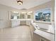 Bright bathroom with a large soaking tub, double vanity, and a serene outdoor view at 2123 Tigger Ne Trce, Marietta, GA 30066
