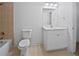 Bathroom including a white vanity with a toilet and shower and tile flooring at 2123 Tigger Ne Trce, Marietta, GA 30066