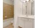 Bathroom featuring tiled walls, sink with vanity, and walk-in shower at 2123 Tigger Ne Trce, Marietta, GA 30066