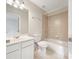 Bathroom featuring tiled walls, sink with vanity, and walk-in shower at 2123 Tigger Ne Trce, Marietta, GA 30066